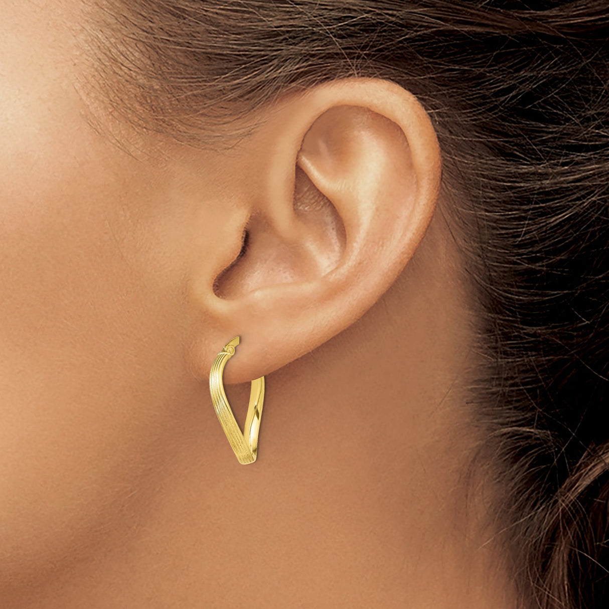 10k Yellow Gold Twisted Oval Hoop Earrings with High Polish and Ribbed Detailing