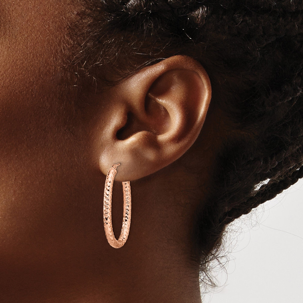 14k Rose Gold Oval Hoop Earrings with Diamond Cut Texture and Polished Finish