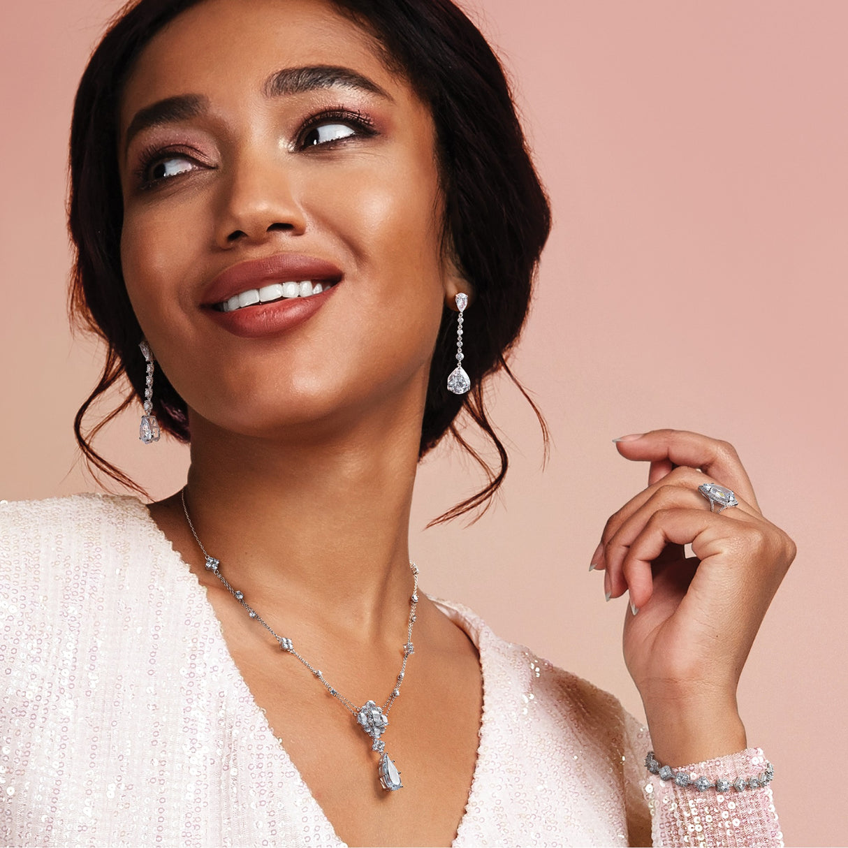 Sterling Silver Dangle Earrings with Pear Shaped Cubic Zirconia and Round CZ Accents