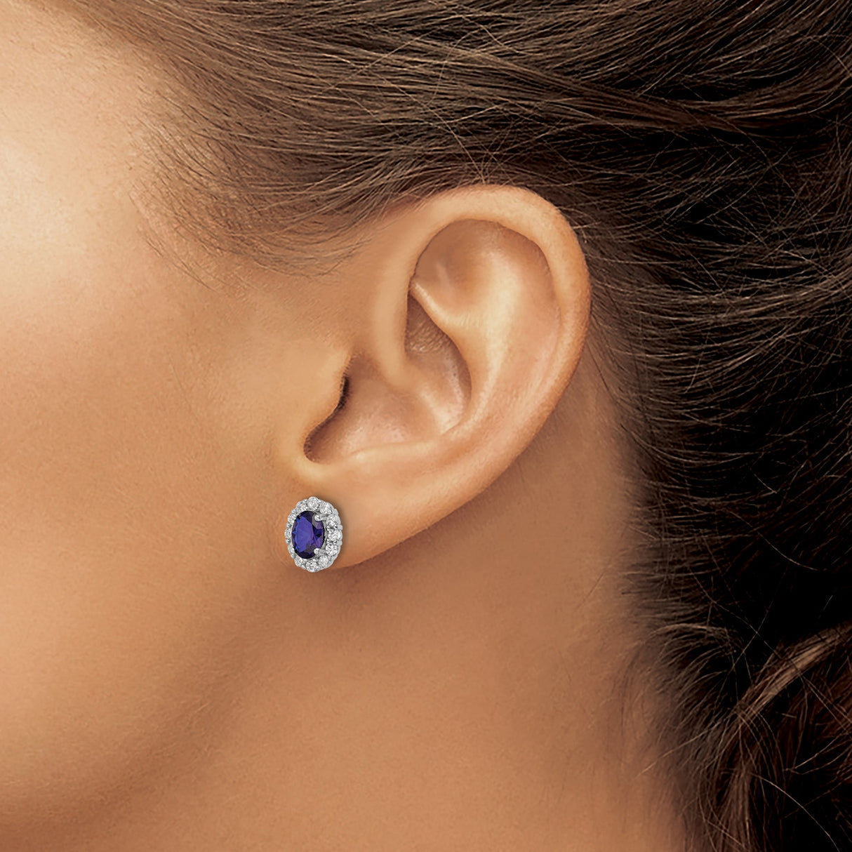 Sterling Silver Oval Stud Earrings with Deep Blue Center Cubic Zirconia and Halo Design