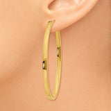 14k Yellow Gold Oval Hoop Earrings with Polished Finish and Hinged Closure for Women