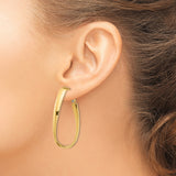 14k Yellow Gold Twisted Hoop Earrings with Elongated Teardrop Shape and Polished Finish