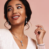 Sterling Silver Dangle Earrings with Pear Shaped Cubic Zirconia and Round CZ Accents