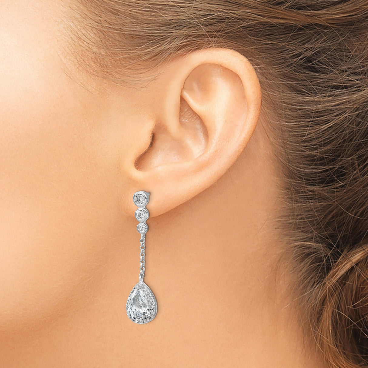Sterling Silver Dangle Earrings with Three Bezel-Set Cubic Zirconia and Teardrop Halo Design
