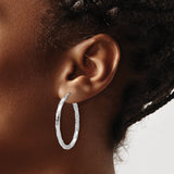 Sterling Silver Twisted Oval Hoop Earrings with Hammered Diamond Cut Texture