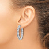 Sterling Silver Hoop Earrings with Round and Baguette Cubic Zirconia, Inside Out Oval Design