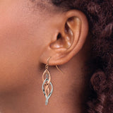 Stainless Steel Twisted Teardrop Dangle Earrings with Interlaced Strands in Rose Gold Tone