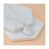 14k White Gold Oval Locket Pendant with Floral Engraving and Scroll Design